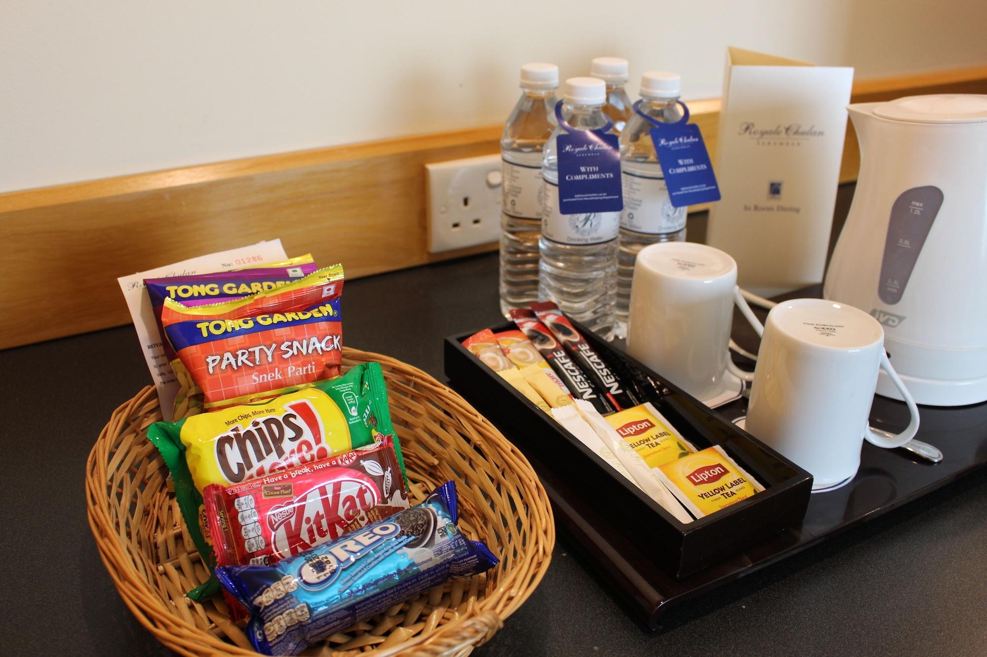 Royale Chulan Seremban Hotel Exterior photo A selection of snacks and bottled water in a hotel room